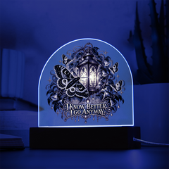 Moth and lantern acrylic lamp glowing with blue LED light